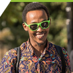 A young black man wearing Camosun sunglasses.